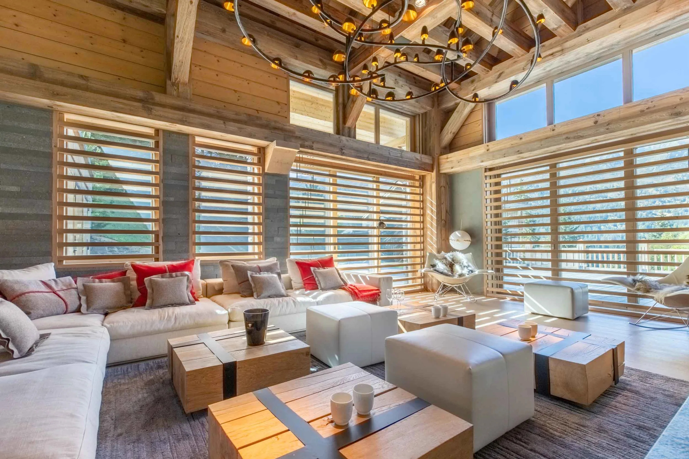 Living area of a Méribel chalet with a glass fireplace